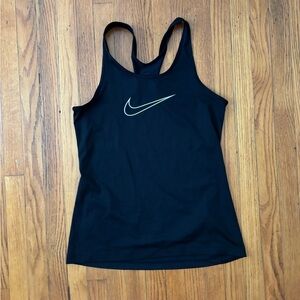 It is a nike tank top. It is a size medium. It is black with a white nike swoosh